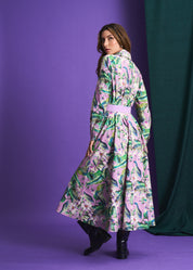 Woman wearing a floral dress against a purple background