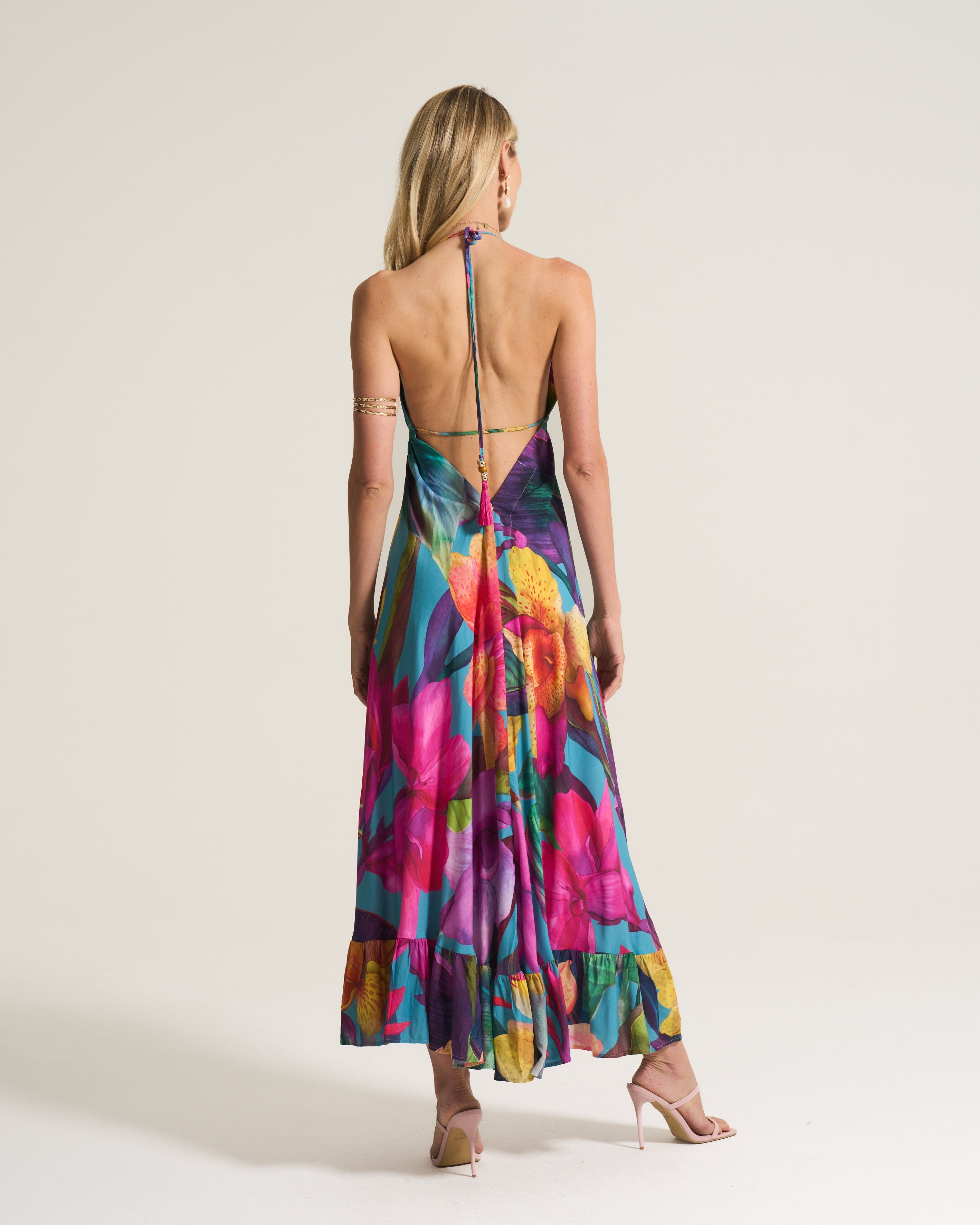 Woman wearing a colorful dress with a white background